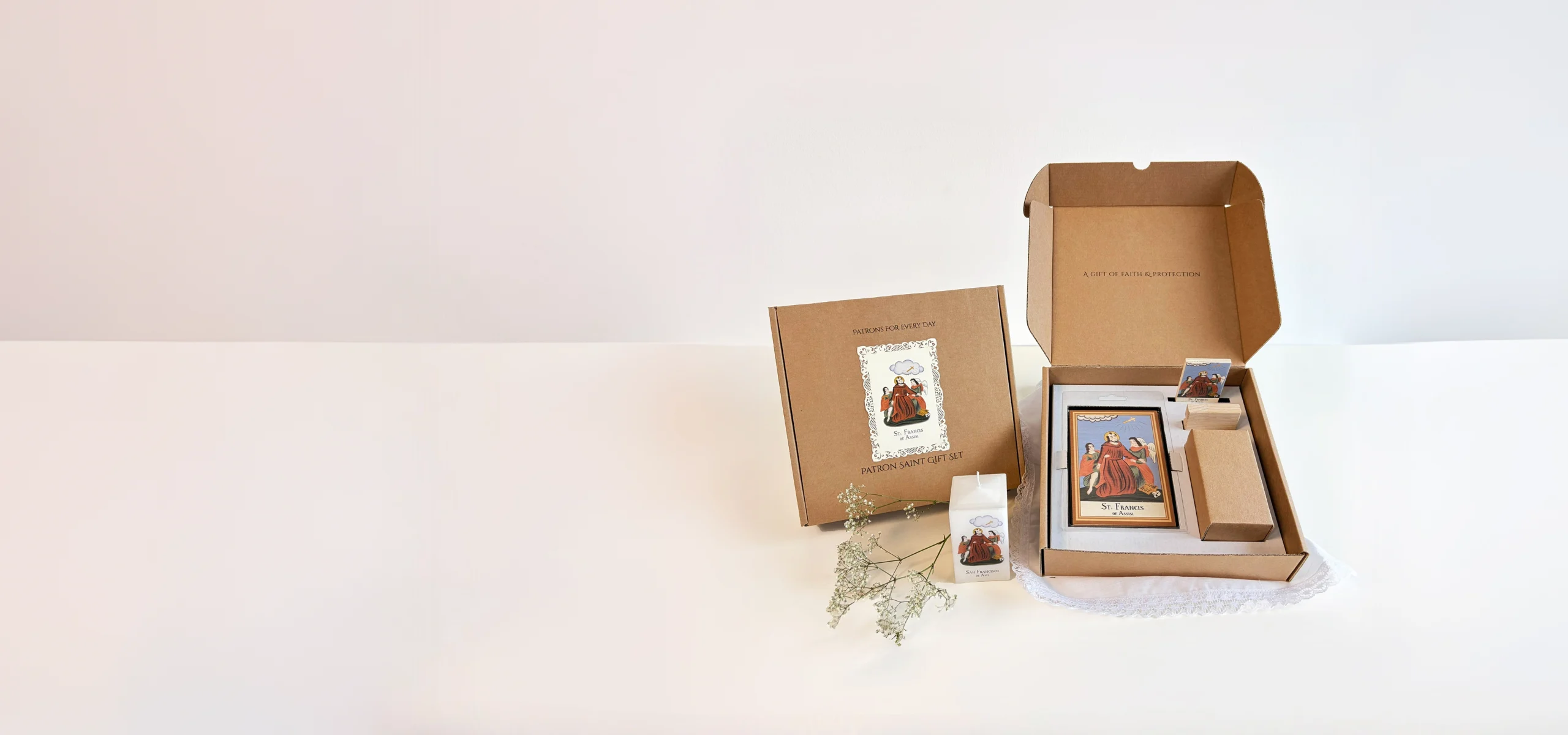 Catholic gift set with saint plaque, candle and holy card in kraft box